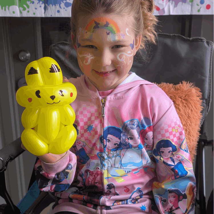 Girl with Pokeman Balloon Animal and Face Paint
