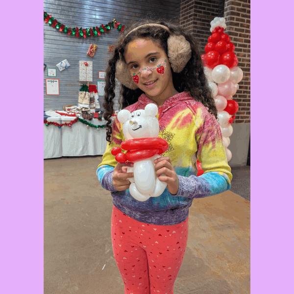 Girl with twisted balloon bear in Hamilton Ontario by Phil the Balloon Guy
