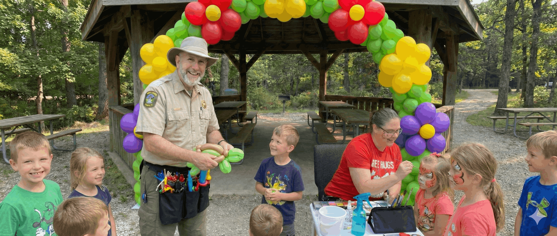 Whimsy and Mirth Balloon Artistry and Props on location at park in Hamilton Twisting Balloons and Face Painting